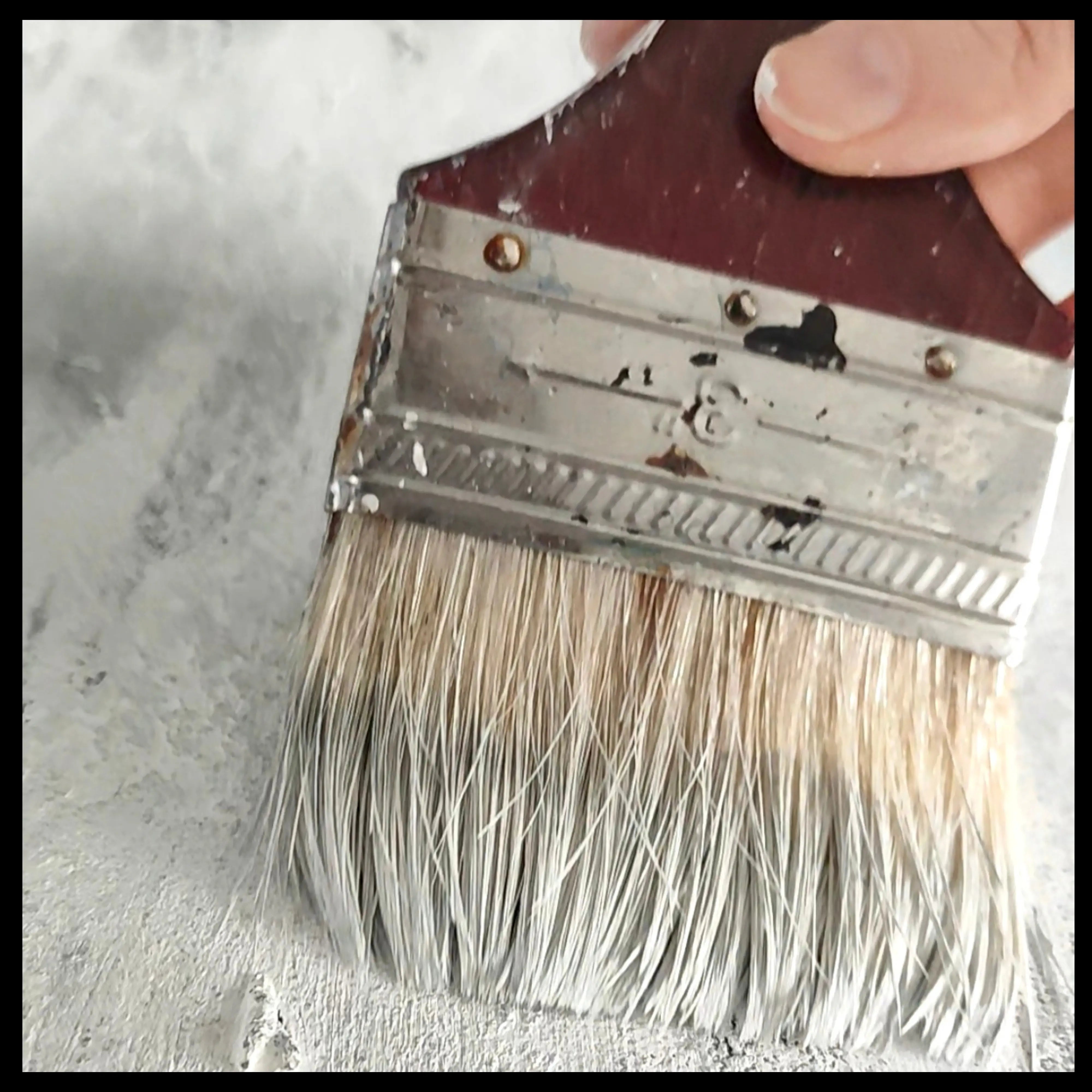 Close up on abstract painting in the making, brush on the canvas in the artist studio of Anez Ka, luxury fine artist. 